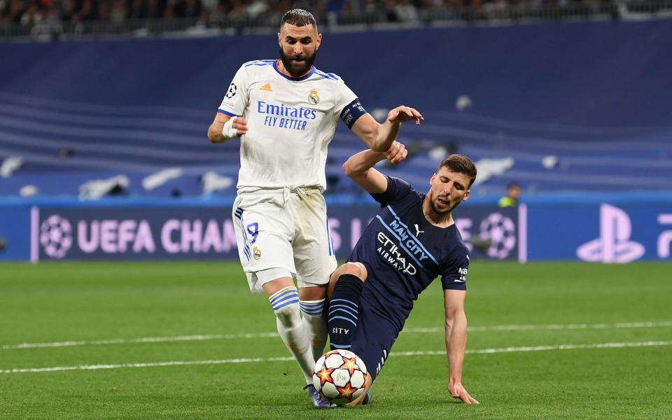 Ruben Dias felled Karim Benzema in the box - GETTY IMAGES