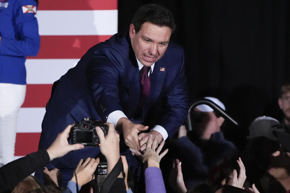 Republican presidential candidate Florida Gov. Ron DeSantis greets supporters during a caucus night party, Monday, Jan. 15, 2024, in West Des Moines, Iowa. (AP Photo/Charlie Neibergall)