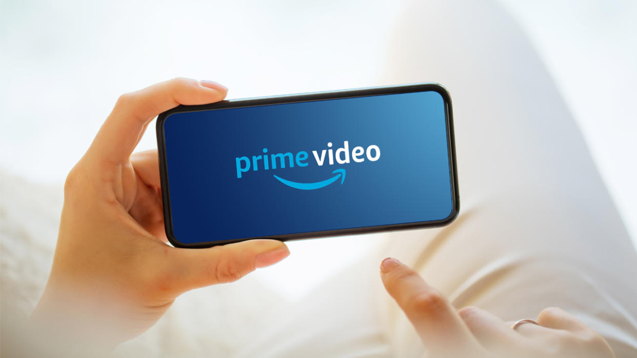  Amazon Prime Video logo on a phone being held by someone. 