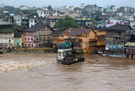 Houses and temples are seen submerged in the waters of overflowing river Godavari after heavy rainfall in Nashik