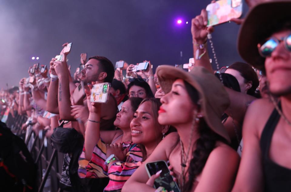 Fans watch Bad Bunny perform on the Coachella Stage at the Coachella Valley Music and Arts Festival at the Empire Polo Club in Indio, Calif., Friday, April 21, 2023. 