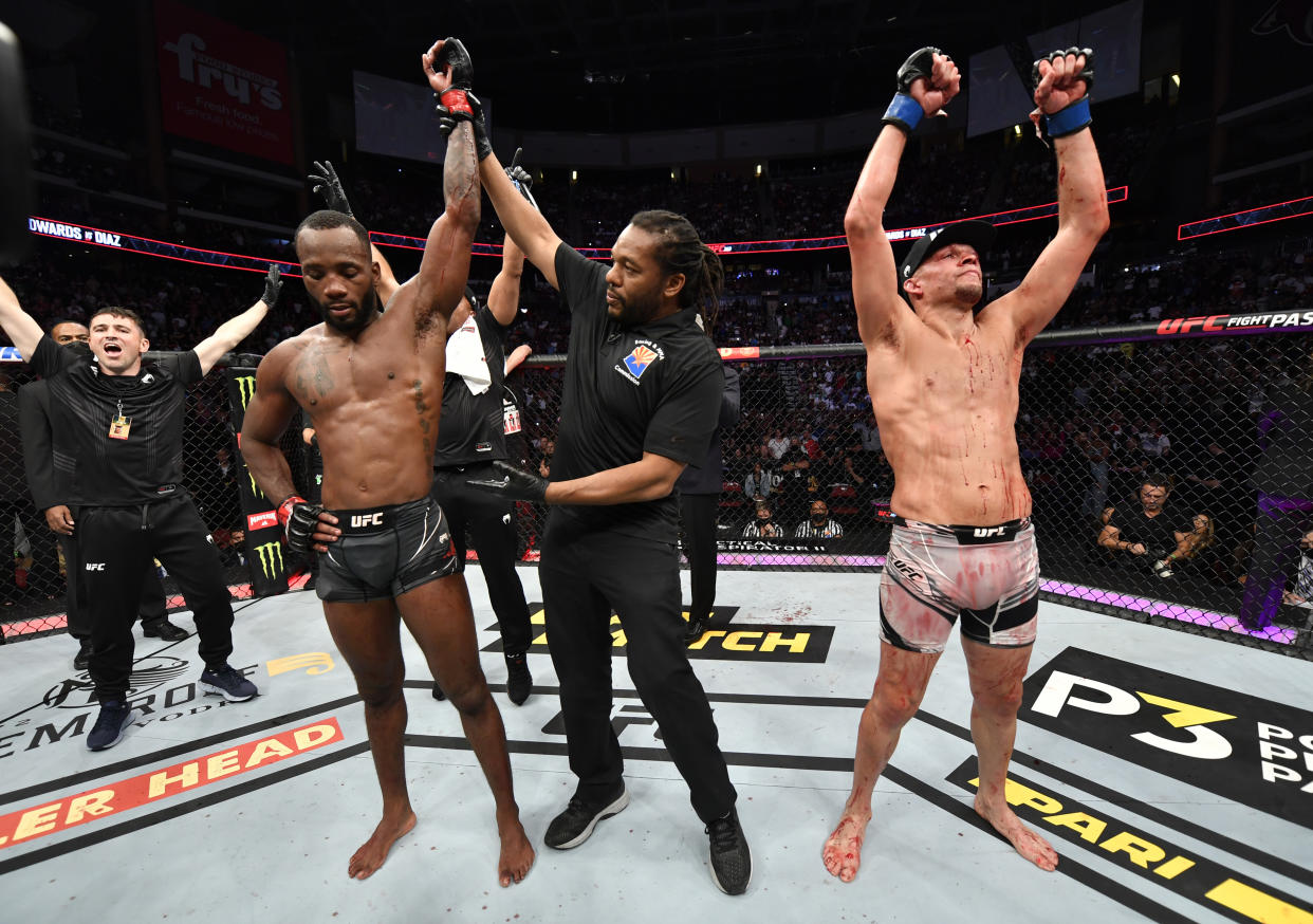 GLENDALE, ARIZONA - JUNE 12: (L-R) Leon Edwards of Jamaica reacts after his decision victory over Nate Diaz in their welterweight fight during the UFC 263 event at Gila River Arena on June 12, 2021 in Glendale, Arizona. (Photo by Jeff Bottari/Zuffa LLC)