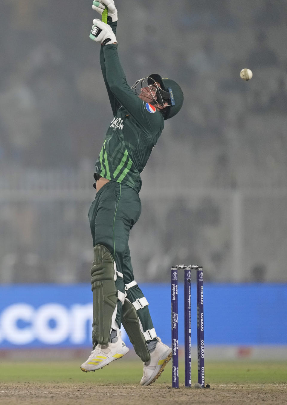 Pakistan's Mohammad Wasim reaches for a rising delivery during the ICC Men's Cricket World Cup match between Pakistan and England in Kolkata, India, Saturday, Nov. 11, 2023. (AP Photo/Bikas Das)