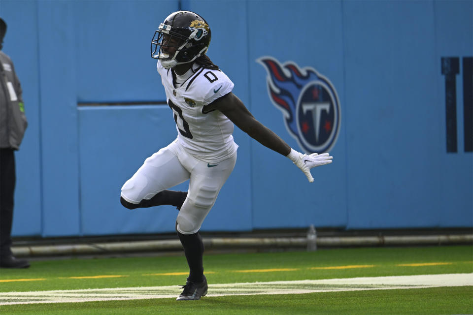 Jacksonville Jaguars wide receiver Calvin Ridley (0) celebrates his touchdown catch against the Tennessee Titans during the first half of an NFL football game Sunday, Jan. 7, 2024, in Nashville, Tenn. (AP Photo/John Amis)
