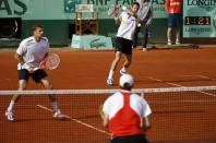 Belarus Max Mirnyi (L) and Canada's Daniel Nestor (R) hit a return to US Bob Bryan and US Mike Bryan during Men's Doubles final tennis match of the French Open tennis tournament at the Roland Garros stadium, on June 9, 2012 in Paris. AFP PHOTO / THOMAS COEXTHOMAS COEX/AFP/GettyImages