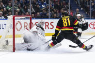 Arizona Coyotes goaltender Connor Ingram (39) stops Vancouver Canucks' Dakota Joshua (81) during the third period of an NHL hockey game Wednesday, April 10, 2024, in Vancouver, British Columbia. (Ethan Cairns/The Canadian Press via AP)