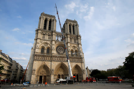 FILE PHOTO: Notre Dame cathedral is pictured after a ceremony at the Paris City Town Hall, in Paris, France April 18, 2019. Michel Euler/Pool via Reuters