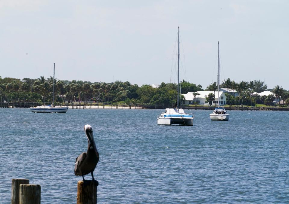 Boats are seen anchored in the Indian River Lagoon off the northwest side of Jensen Beach Causeway Park on Wednesday, May 5, 2021.  