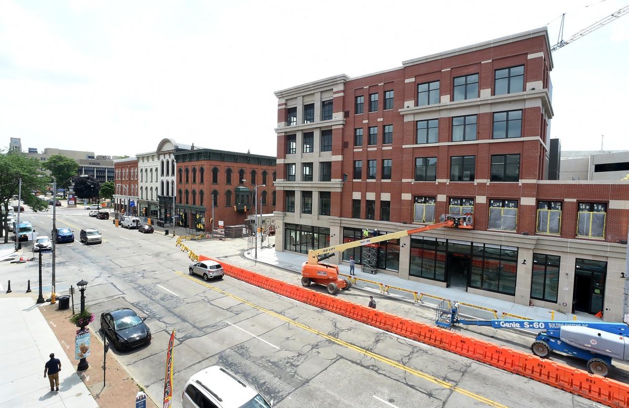 Construction continues on a building at West Fifth and State streets, owned by the Erie Downtown Development Corporation, in Erie on July 6, 2023. Ascend Erie, a climbing gym featuring a four-story climbing wall, and more than 30 residential apartments will fill the space when open.