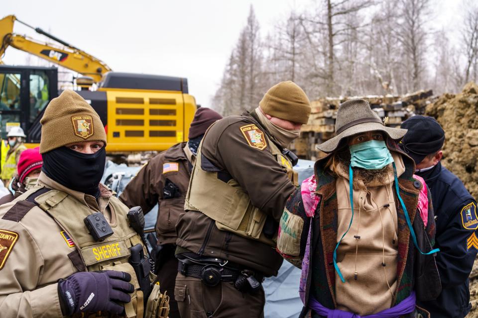 Sheriffs in Aitkin County, Minnesota, arrest "water protectors" during a protest at the construction site of the Line 3 oil pipeline. (Photo: Kerem Yucel/AFP/Getty Images)