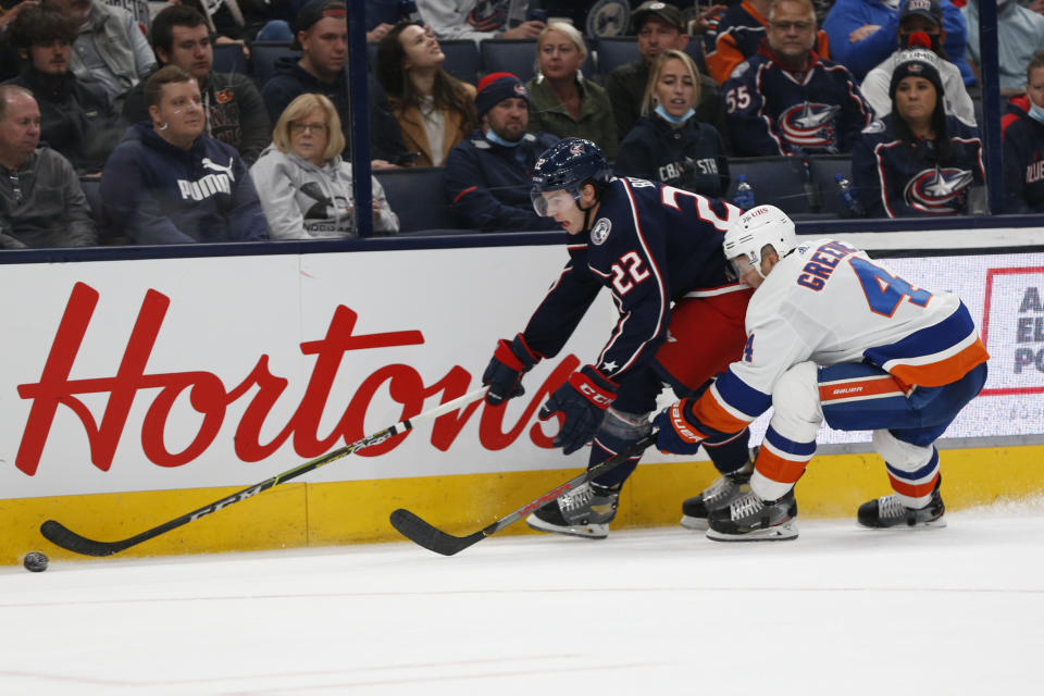 New York Islanders' Andy Greene, right, chases Columbus Blue Jackets' Jake Bean across the blue line during the second period of an NHL hockey game Thursday, Oct. 21, 2021, in Columbus, Ohio. (AP Photo/Jay LaPrete)