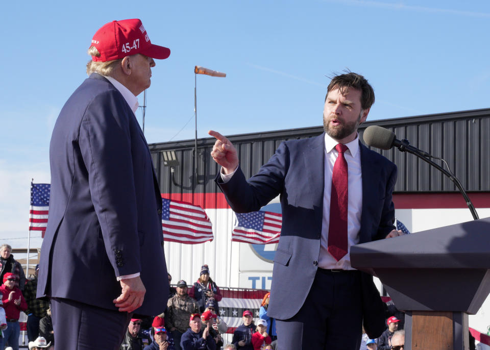 FILE - Sen. J.D. Vance, R-Ohio, right, points toward Republican presidential candidate former President Donald Trump at a campaign rally, March 16, 2024, in Vandalia, Ohio. Vance is a top contender to be selected as Trump's running mate. (AP Photo/Jeff Dean, File)