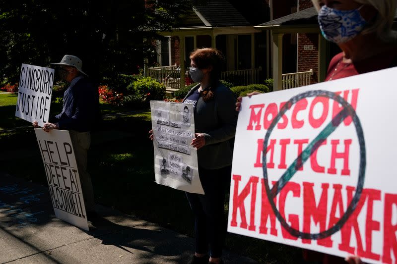 Protesters gather outside the home of US Senate Majority Leader Mitch McConnel in Louisville