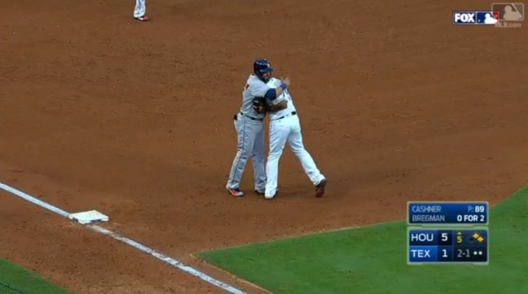 Adrian Beltre and Carlos Beltran hug during Saturday's game. (Screenshot via MLB.com)