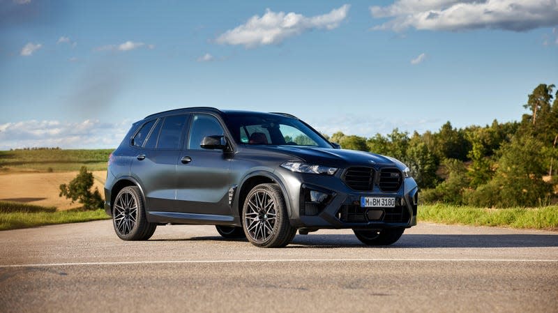 A BMW X5 M Competition stopped on a strip of pavement