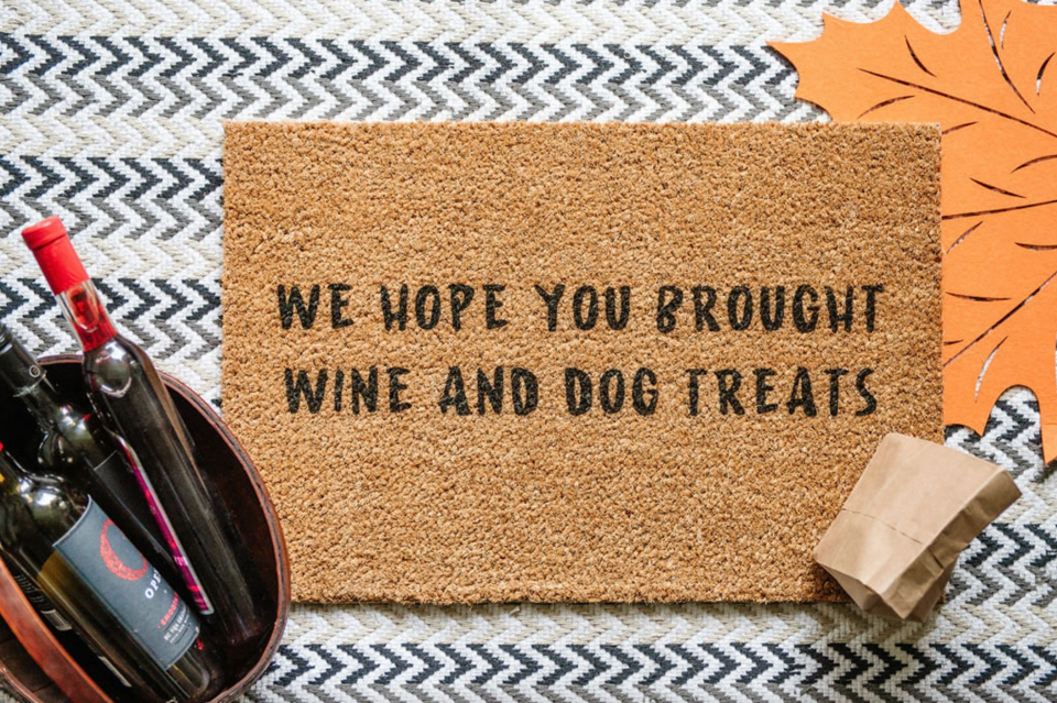 'We Hope You Brought Wine and Dog Treats' Door Mat (Photo via Etsy)