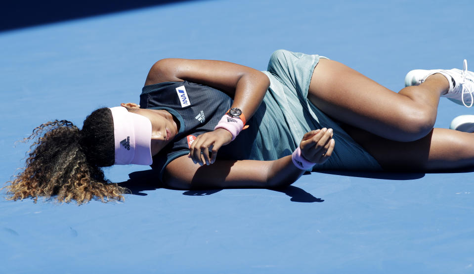 Japan's Naomi Osaka falls during her third round match against Taiwan's Hsieh Su-Wei at the Australian Open tennis championships in Melbourne, Australia, Saturday, Jan. 19, 2019. (AP Photo/Kin Cheung)