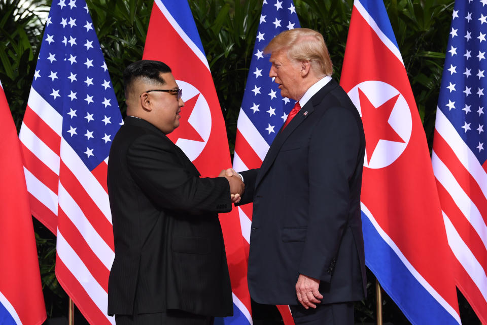 North Korea's leader Kim Jong Un shakes hands with President Donald Trump at the start of their historic U.S.-North Korea summit, at the Capella Hotel on Sentosa island in Singapore on June 12, 2018.