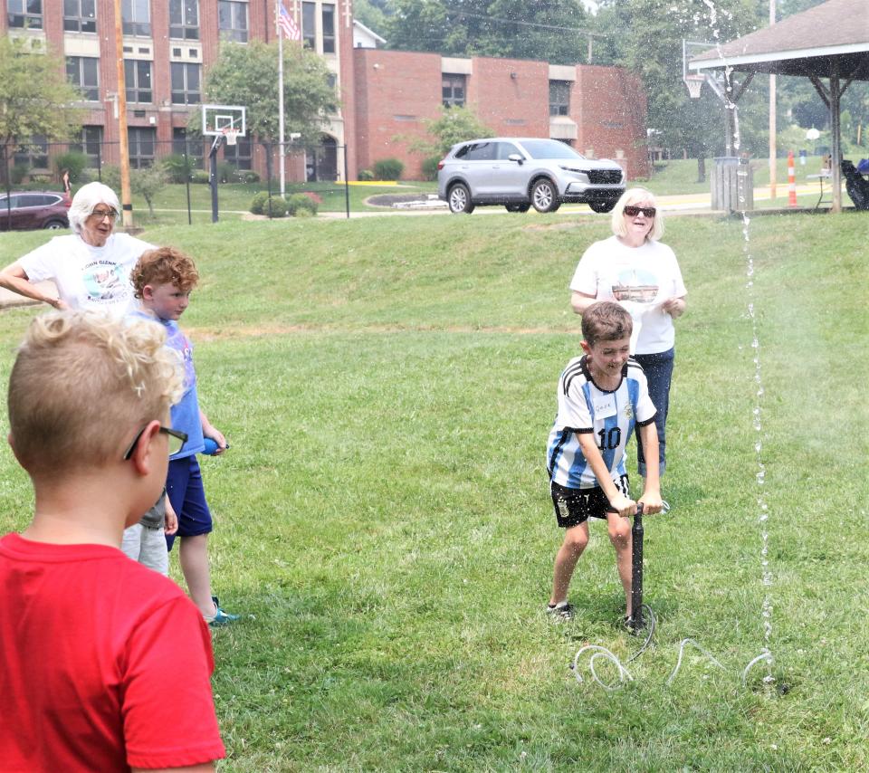 Jack Witucky shoots off a water rocket during an experiment, which was part of Space Days on Monday at the John and Annie Glenn Museum. Water was used as fuel, and each participant used a bike tire pump to add air to a 2-liter bottle in an effort to launch it into the air.