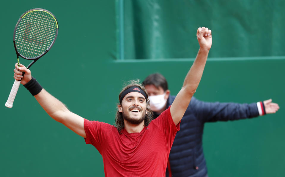 Stefanos Tsitsipas of Greece celebrates after defeating Andrey Rublev of Russia during the Monte Carlo Tennis Masters tournament finals in Monaco, Sunday, April 18, 2021. (AP Photo/Jean-Francois Badias)