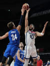 United States's Jayson Tatum (10) is blocked by Czech Republic's Jan Vesely (24) during a men's basketball preliminary round game at the 2020 Summer Olympics, Saturday, July 31, 2021, in Saitama, Japan. (AP Photo/Eric Gay)