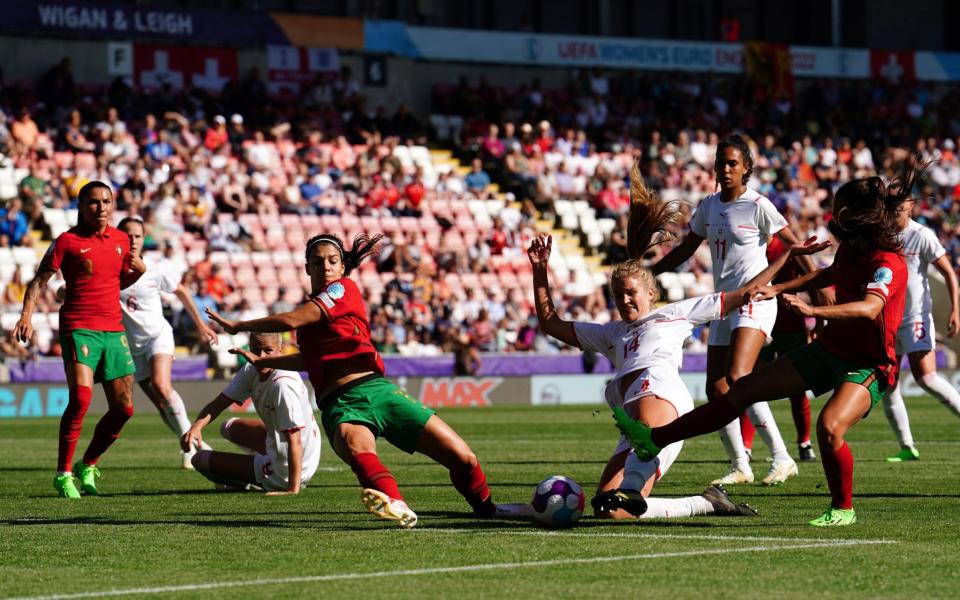 Switzerland's Rahel Kiwic (centre right) attempts a shot on goal during the UEFA Women's Euro 2022 Group C match at Leigh Sports Village, Wigan.  - Martin Rickett/PA