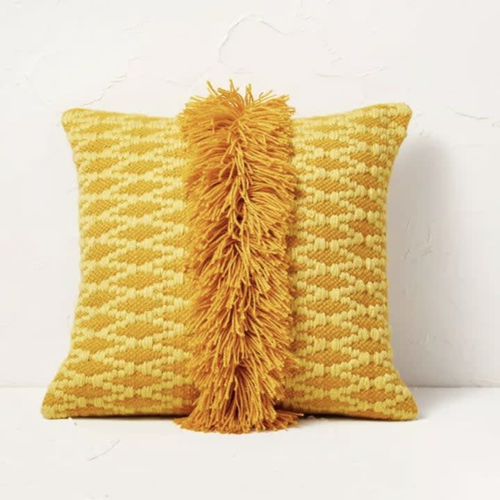 the yellow fringe pillow