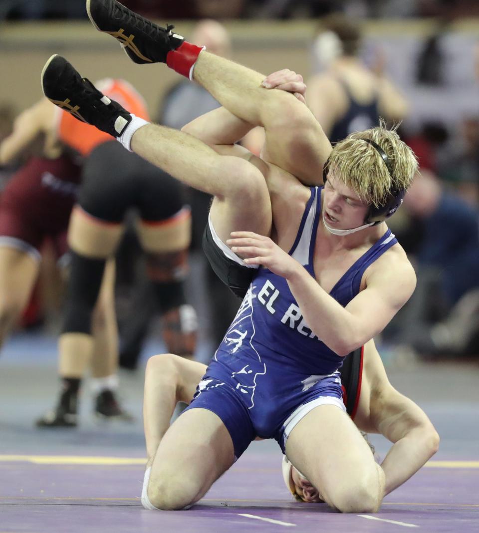 Will Heger of El Reno, top, wrestles Greyson Zellersof Bishop Kelley in a Class 5A 138-pound semifinal match during the Oklahoma state wrestling tournament at State Fair Arena in Oklahoma City, Friday, Feb. 24, 2023. 