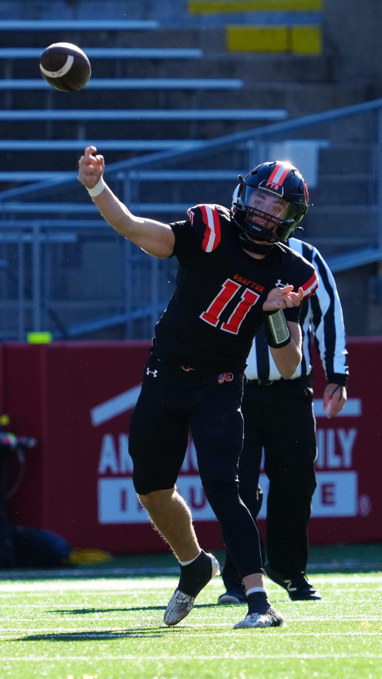 Grafton quarterback Brady Hilgart (11) delivers a pass during the WIAA Division 3 state championship football game against Rice Lake at Camp Randall Stadium in Madison on Friday, November 17, 2023.