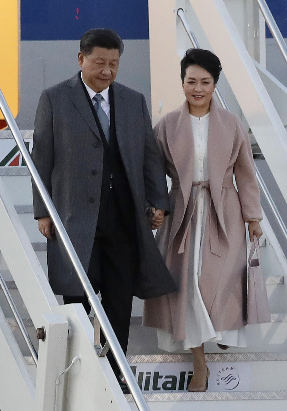 Chinese President Xi Jinping and his wife Peng Liyuan arrive at Rome's Leonardo Da Vinci airport in Fiumicino, Italy, Thursday, March 21, 2019. Jinping is in Italy to sign a memorandum of understanding to make Italy the first Group of Seven leading democracies to join China's ambitious Belt and Road infrastructure project. (AP Photo/Andrew Medichini)