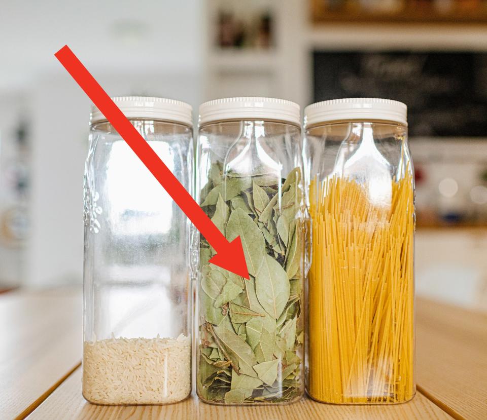 jars of ingredients with an arrow pointing to bay leaves