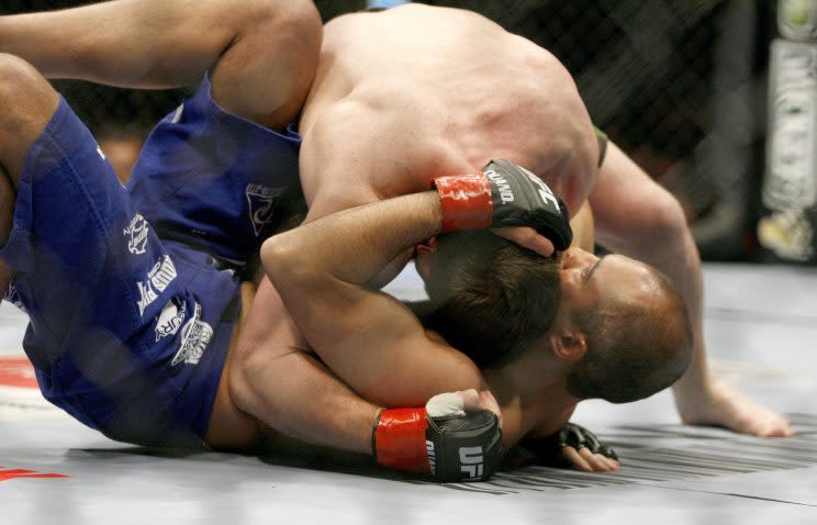 Ex-UFC welterweight champion Matt Hughes (top) moves into position against Royce Gracie at UFC 60 in 2006. (Getty Images)