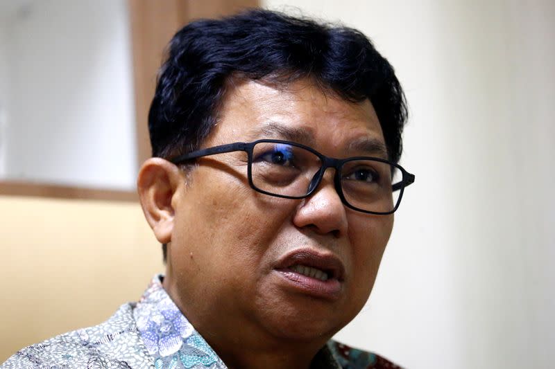 Chief Executive of Sulianti Saroso Hospital, Muhammad Syahril gestures as he talks during an interview at his office in Jakarta, Indonesia