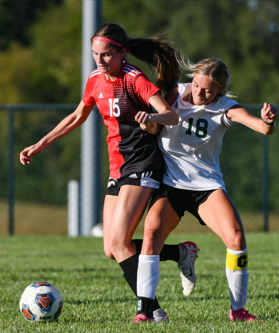 Edgewood’s Emma Edwards (15) and Monrovia’s Emery Newlin fight for possession of the ball during their girls’ soccer match at Edgewood on Thursday, August 31, 2023.