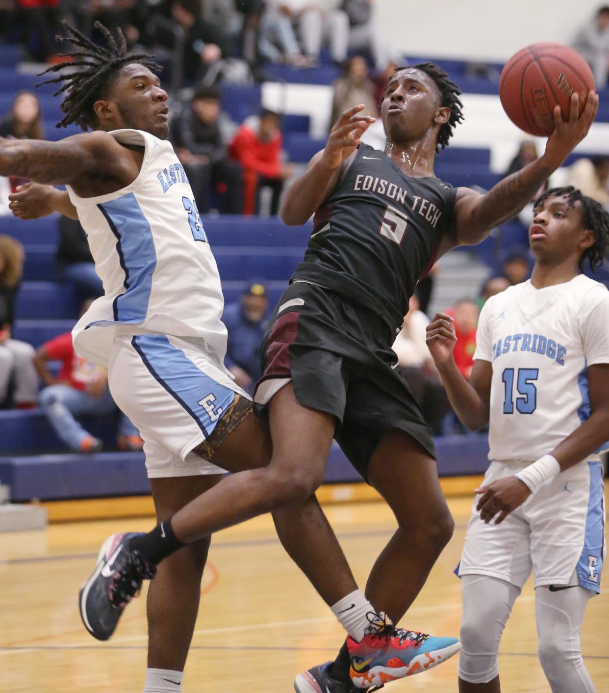 Edison's Davijon Lipscomb gets the off balance bucket and the foul on Eastridge's Tariq Fryer.