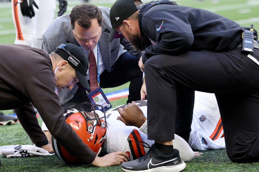 INDIANAPOLIS, INDIANA – OCTOBER 22: Deshaun Watson #4 of the Cleveland Browns is attended to by medical staff after an apparent injury during the second quarter against the Indianapolis Colts at Lucas Oil Stadium on October 22, 2023 in Indianapolis, Indiana. (Photo by Michael Hickey/Getty Images)