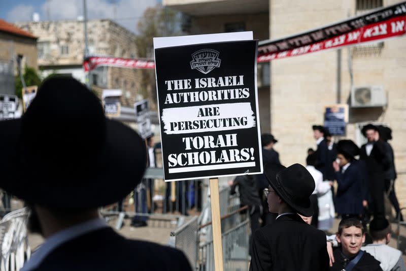FILE PHOTO: Ultra-Orthodox Jewish men protest against attempts to change government policy that grants ultra-Orthodox Jews exemptions from military conscription, in Jerusalem