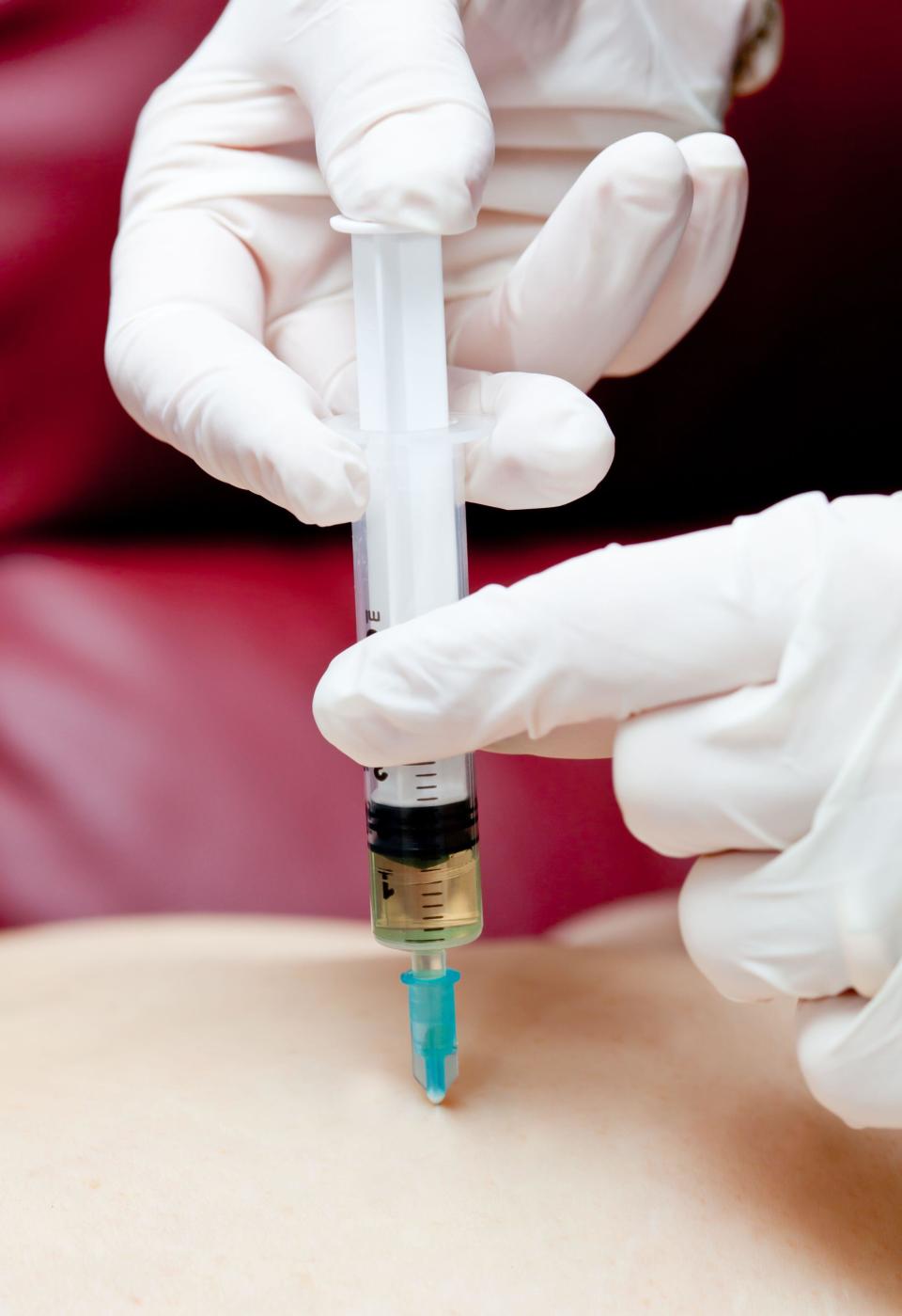 Injection syringe with medicine in the buttock.