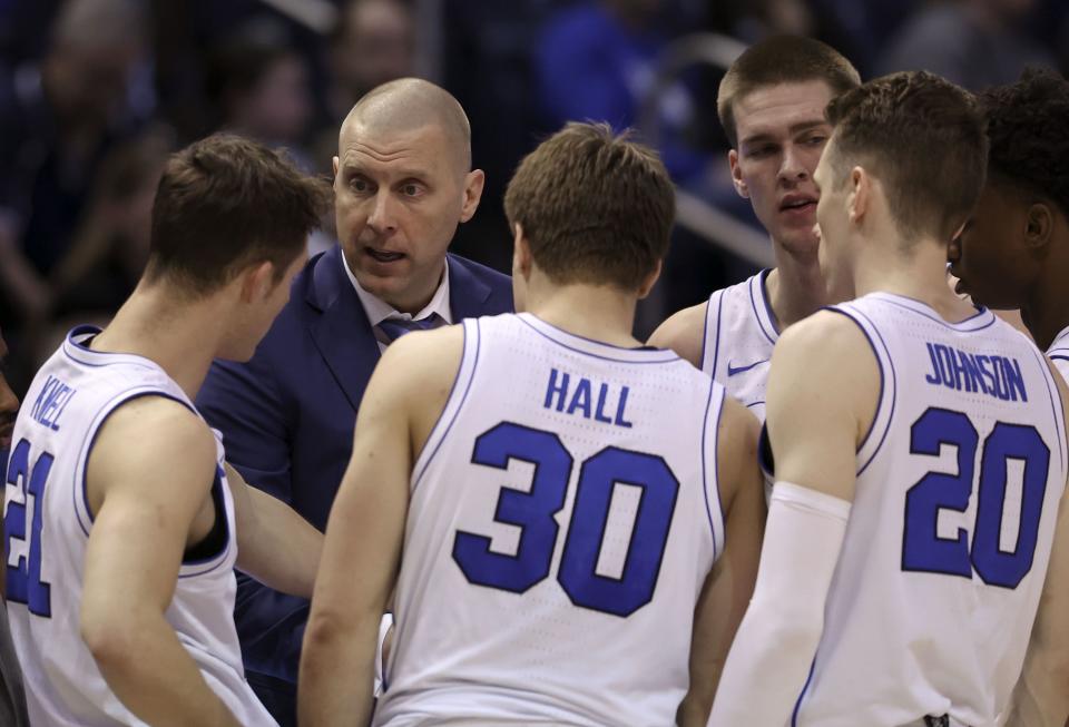 BYU’s head coach Mark Pope instructs his team during a timeout against the UCF Knights at the Marriott Center in Provo on Tuesday, Feb. 13, 2024.