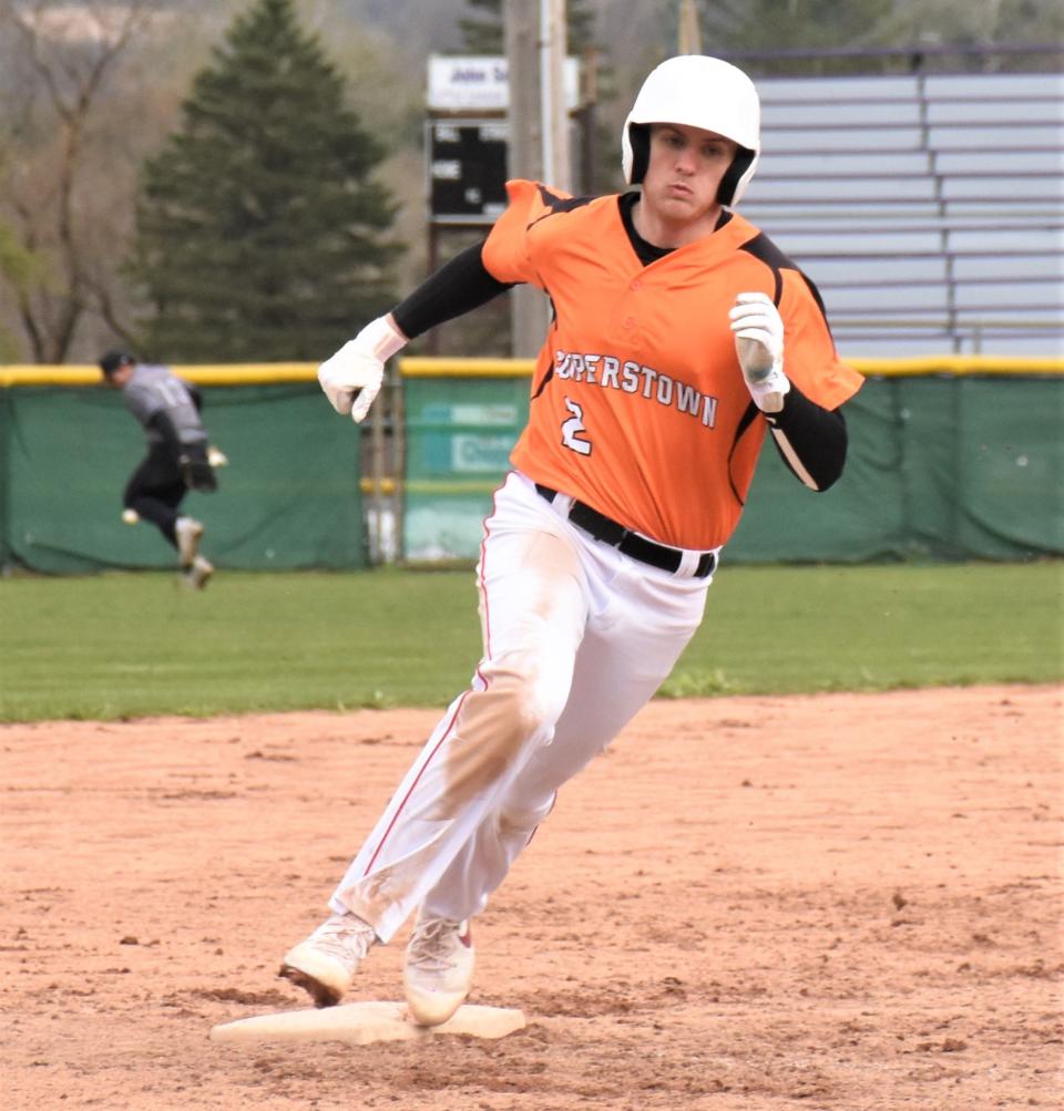 Cooperstown Hawkeye Kalen Dempsey rounds third base at Veterans Memorial Park and heads home to score a run during the eight-run sixth inning of Saturday's 15-7 victory over the Little Falls Mounties.