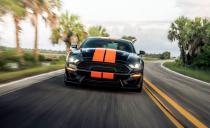 <p>Cosmetic work includes a fiberglass hood, a new front fascia, orange-and-black seat covers, tinted windows, and a sou­venir shop's worth of Shelby logos.</p>
