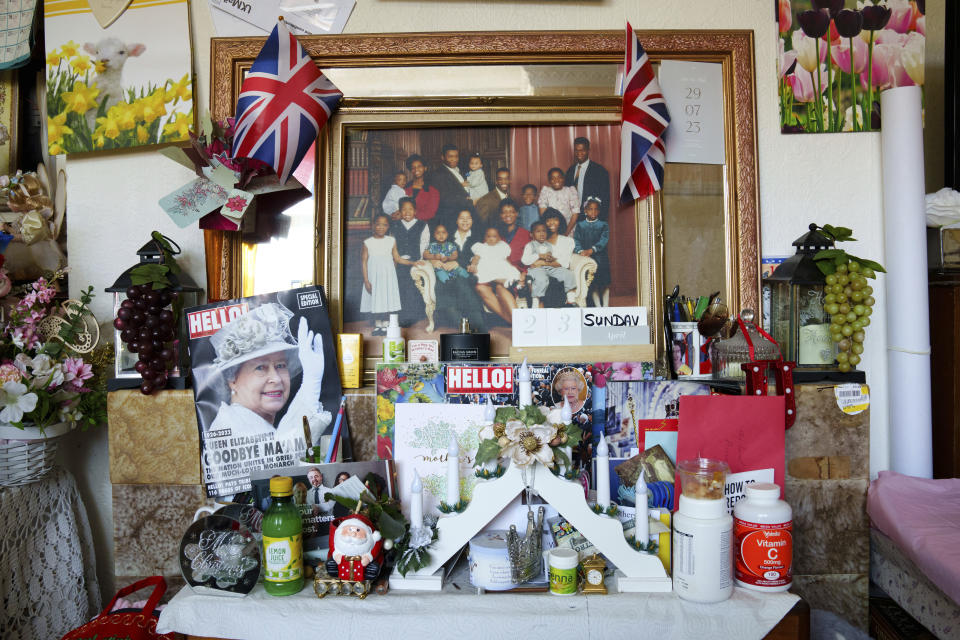 A view of Queen Elizabeth related memorabilia at the home of Sylius and Bridgette Toussaint in Preston, England, Tuesday, April 25, 2023. The pair as children in Dominica remember the coronation of Elizabeth II which took place at Westminster Abbey on 2 June 1953. Sylius Toussaint, now 83, still remembers the coronation song he learned seven decades ago, chuckling as he softly croons out the blessing for "our queen who is crowned today," only occasionally stumbling over a phrase lost to the passage of time. (AP Photo/Jon Super)