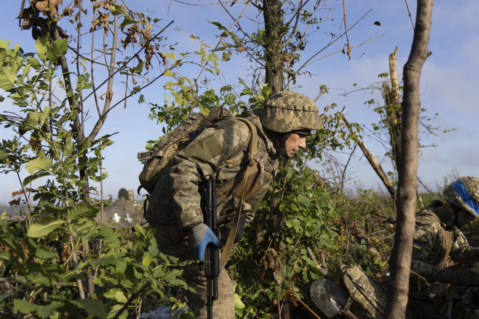 A Ukrainian serviceman walks to his position at the frontline a few kilometers from Andriivka, Donetsk region, Ukraine, Saturday, September 16, 2023. The 3rd Assault Brigade announced Friday they had recaptured the war-ravaged settlement which lies 10 kilometers (6 miles) south of Russian-occupied city of Bakhmut, in the country's embattled east. (AP Photo/Alex Babenko)