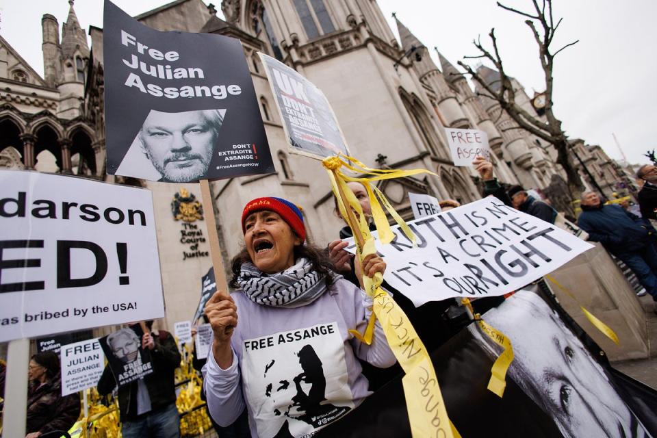 Supporters of WikiLeaks founder Julian Assange gather outside the Royal Courts of Justice (EPA)