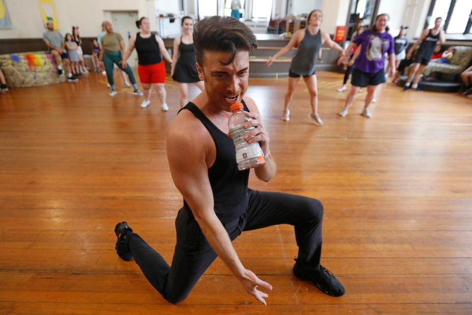 Jesse Luttrell, Pharaoh, and fellow cast members of Joseph and the Amazing Technicolor Dreamcoat rehearse at the First Unitarian Church in New Bedford in preparation for the July 21's opening at the Zeiterion Performing Arts Center.