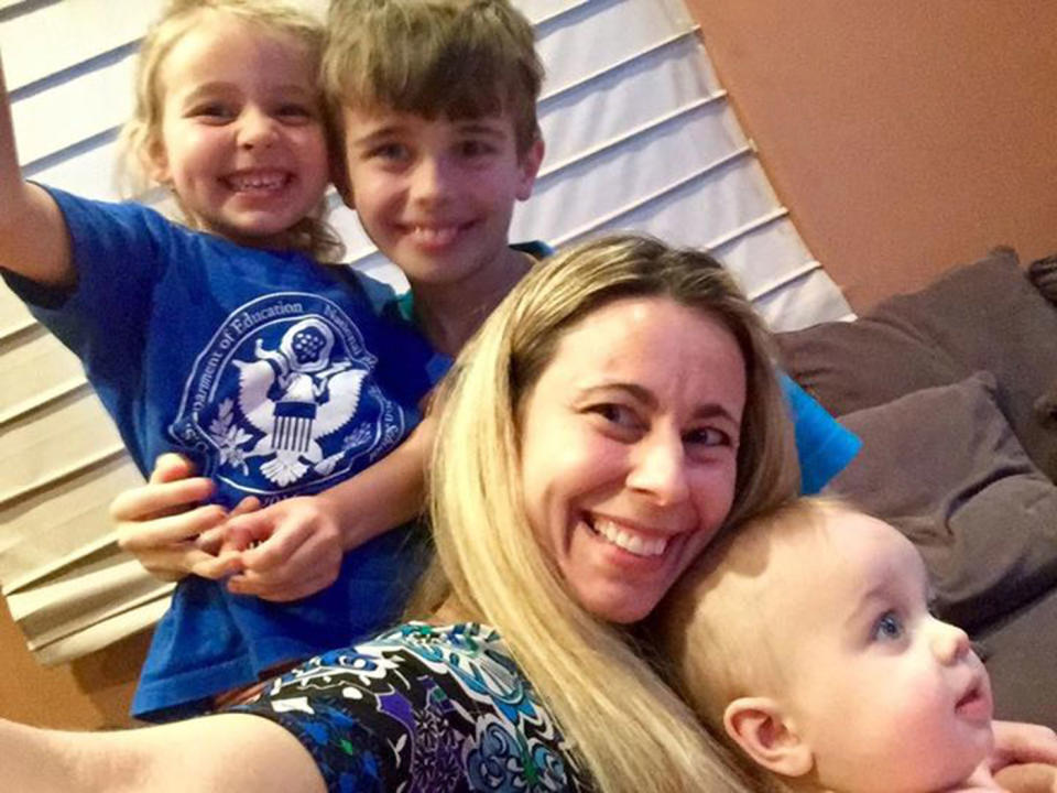 Kristie Homes, 44, pictured with her three kids.