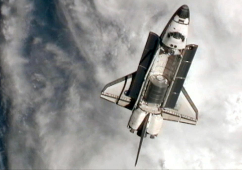 NASA space shuttle Atlantis goes through a nine-minute Rendezvous Pitch Maneuver, or back flip to enable space station crew members to take high resolution digital pictures of the shuttle's heat shield July 10, 2011 in space. (NASA via Getty Images)