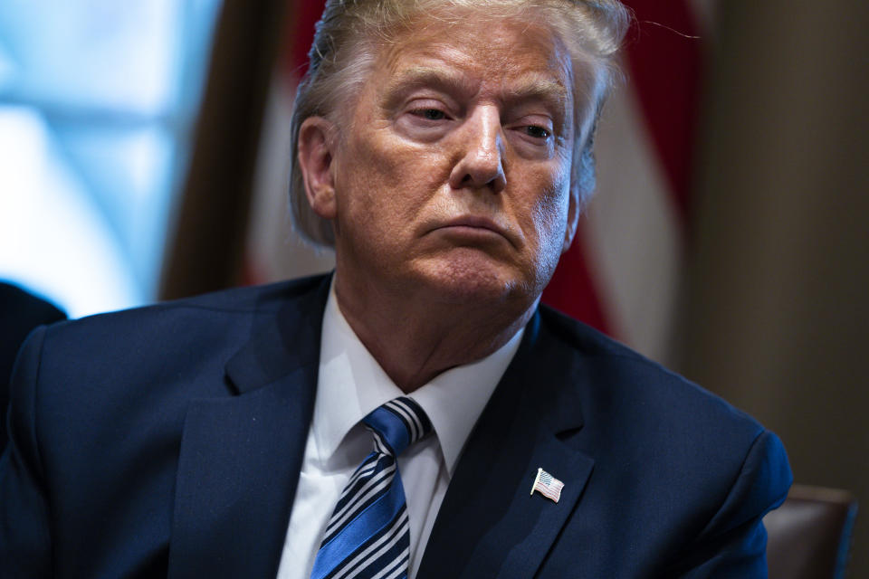 President Donald Trump listens during a meeting with banking industry executives about the coronavirus, at the White House, Wednesday, March 11, 2020, in Washington. (AP Photo/Evan Vucci)