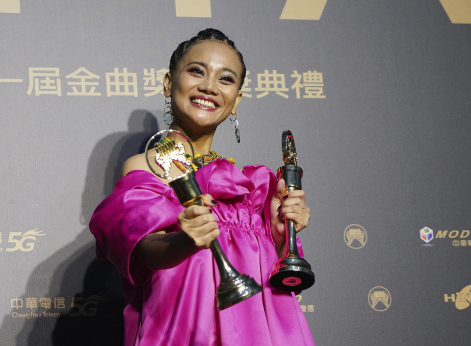 Taiwanese singer Abao holds her awards for Song of the Year and Best Aboriginal Album at the 31th Golden Melody Awards in Taipei, Taiwan, Saturday, Oct. 3, 2020. The awards show, one of the world's biggest Chinese-language pop music annual events was postponed from June to Oct. due to the coronavirus pandemic. (AP Photo/Billy Dai)