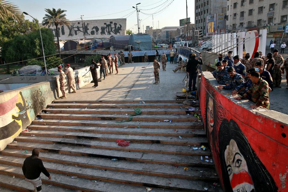 Security forces remove anti-government protesters' tents from their site in Tahrir Square, Baghdad, Iraq, Saturday, Oct. 31, 2020. Iraqi security forces reopened, Saturday, Tahrir Square the epicenter of the long-running anti-government protest movement and Al-Jumhuriyah Bridge which was sealed off by protesters since the protests began in October last year. (AP Photo/Khalid Mohammed)